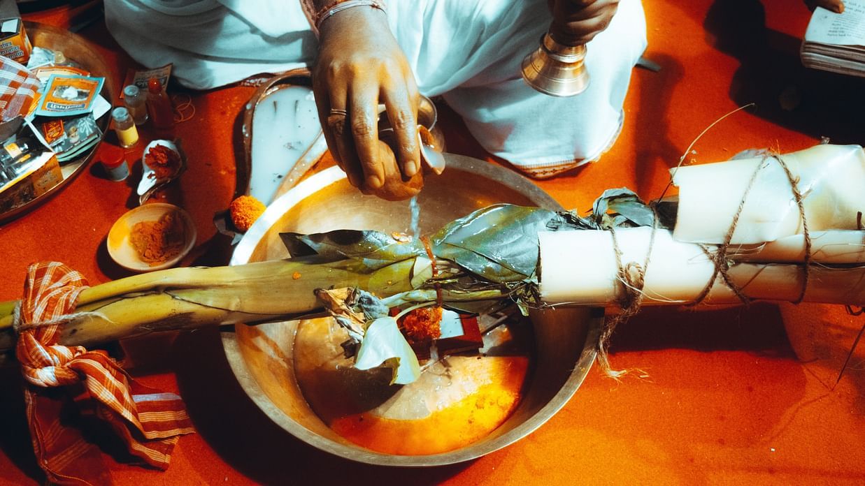 a cook preparing a local Bengali dish