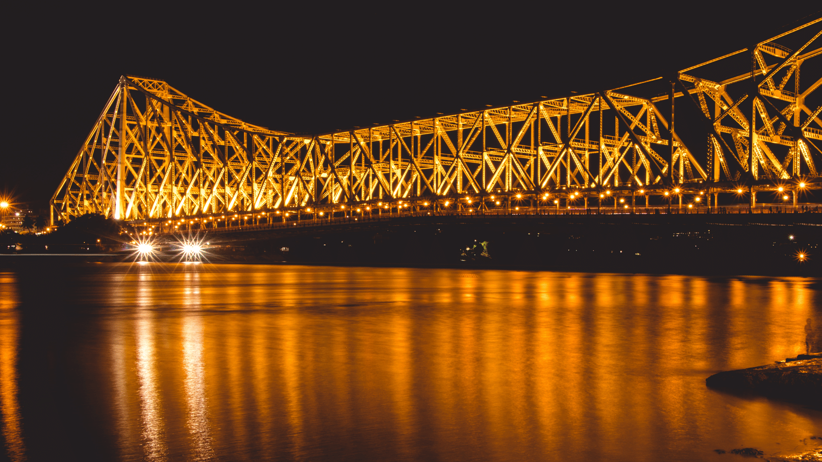 The view of Howrah bridge in the night with lights on 