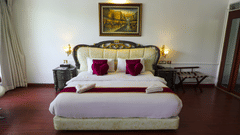 a double bed inside Queen Suite - White pearl suites by rosetum 