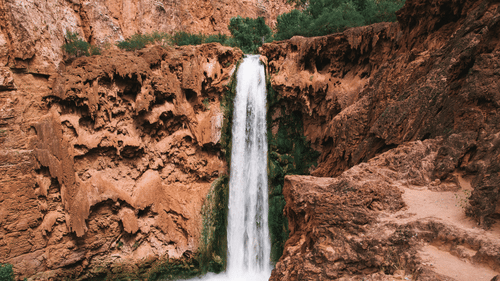 a waterfall amidst rocks