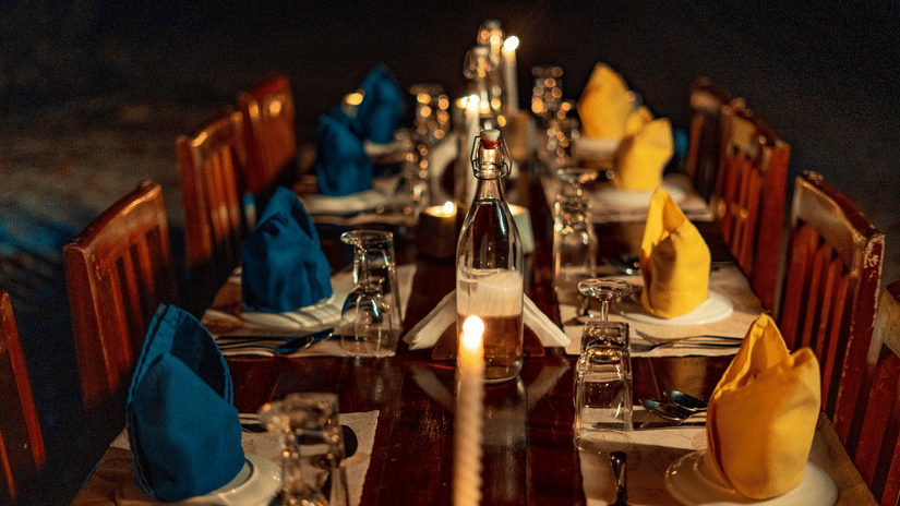 Barefoot at Havelock offers a candlelit beachside dining experience, with an elegantly set table creating a romantic evening by the sea