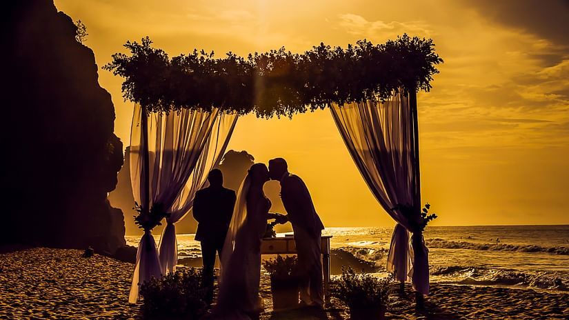 bride and groom kissing at their wedding ceremony