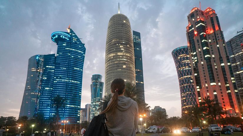 Back View of a Woman Looking at the City Skyscrapers