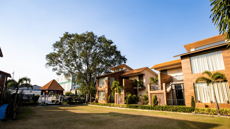 Spacious garden in front of villas at Wedlock Greens Hotel & Resort, Dhanbad