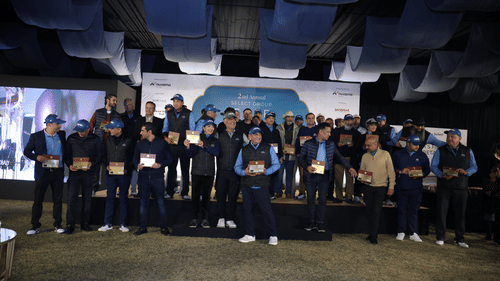 A group photo of people standing in stage holding their memorandum. -  Heritage Village Resorts & Spa