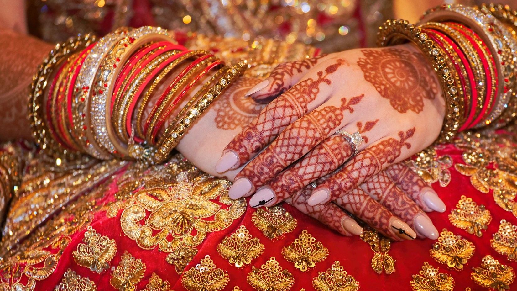 a close up image of a Mehendi on a bride's hands - Hablis Hotel, Chennai