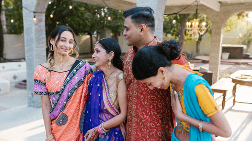 A family wearing new clothes and enjoying a laugh