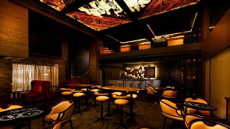 Seating area of Steam and Whistles restaurant at Grand Chennai By GRT Hotels.