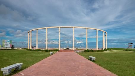 Large open-air event space with a circular structure and green lawns at GRT hotels