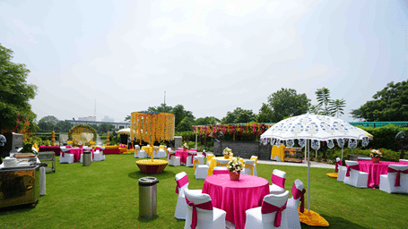 round table seating in the lawn at Karma Lakelands.