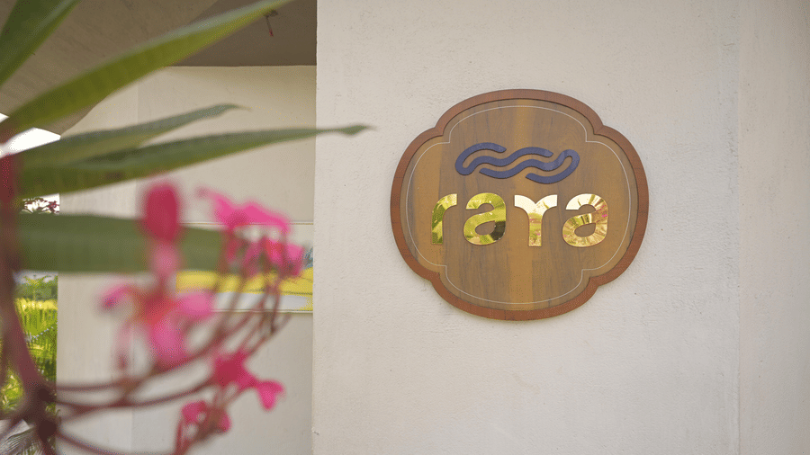 A close-up shot of the spa logo mounted on a wall at Hotel Sonar Bangla, Mayapur.