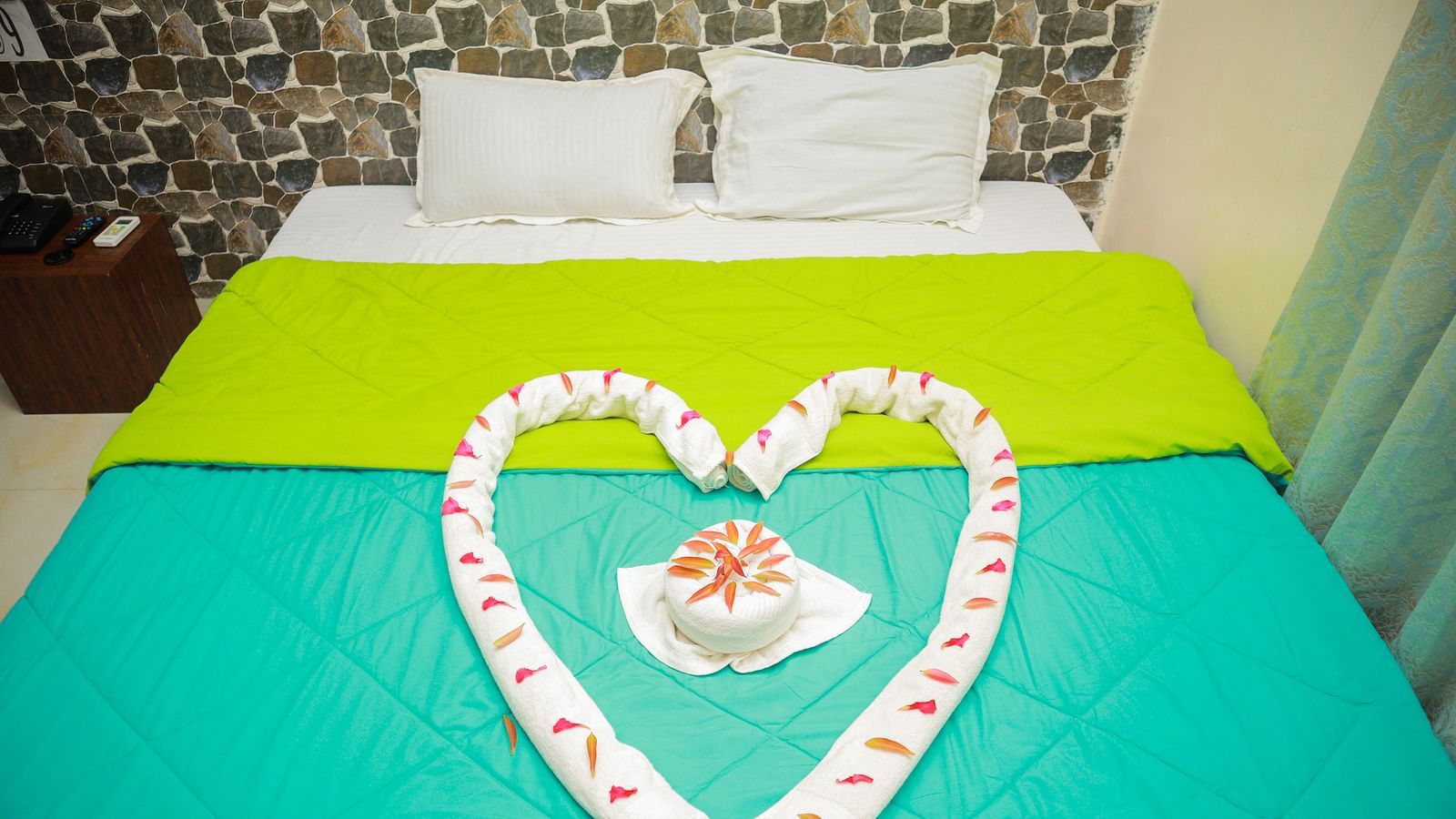 front view image of a king size bed with two pillows at the far end of the bed 