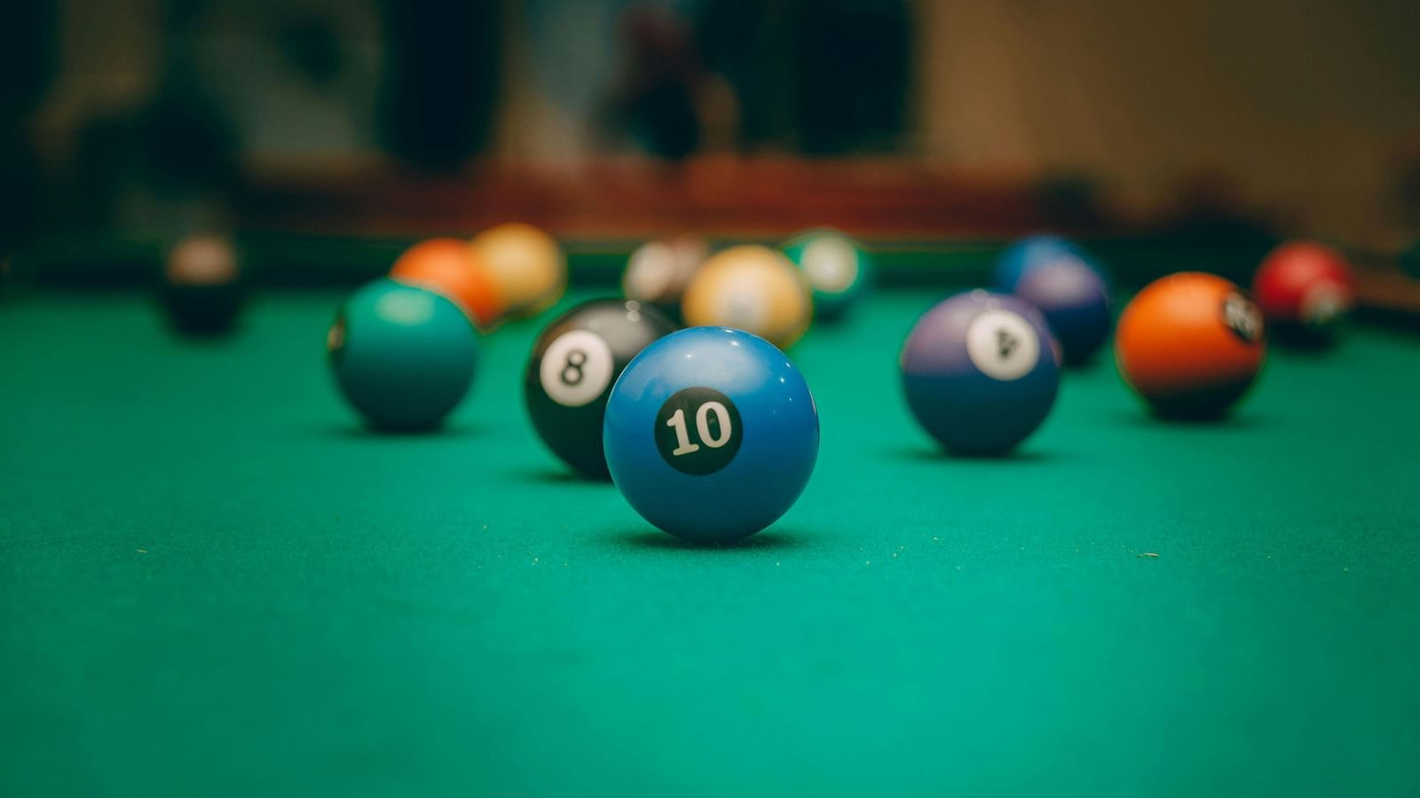 A close up of balls placed on a billiards table