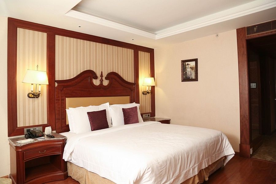 Cosy room with king size bed and modern interiors at Hablis Hotel, Chennai