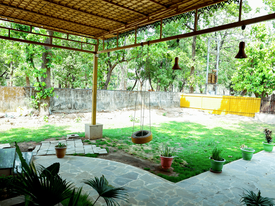 Outdoor garden seating at Signum Resort, Bandhavgarh