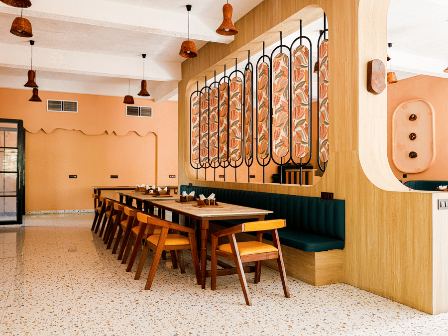 Tables set in the restaurant at Signum Resort, Bandhavgarh