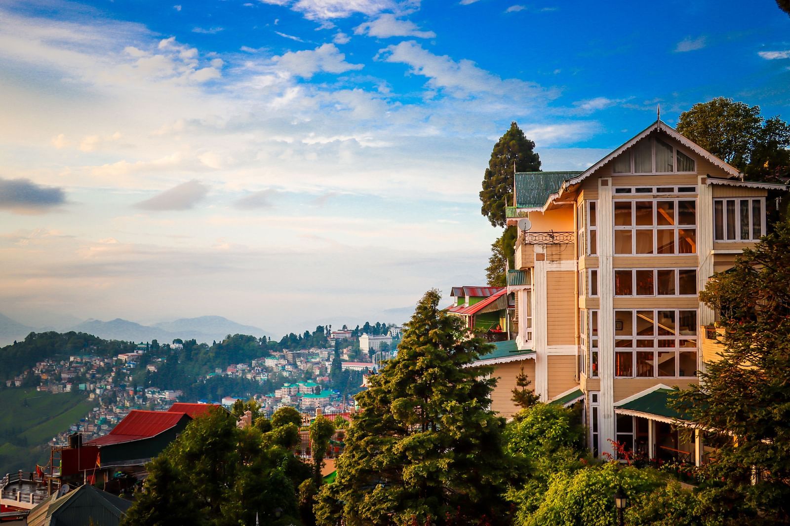Cedar Inn with hillside views and blue sky