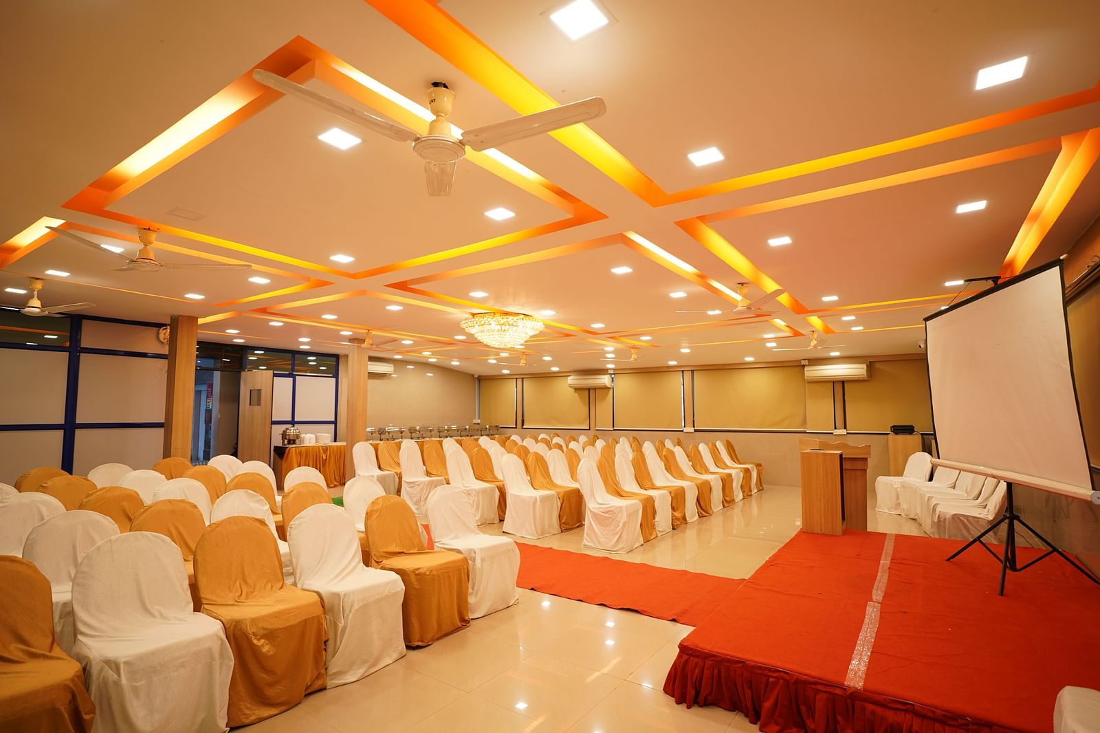 an image of a event hall with a projector and a white screen at  City Centre Residency, Bangalore
