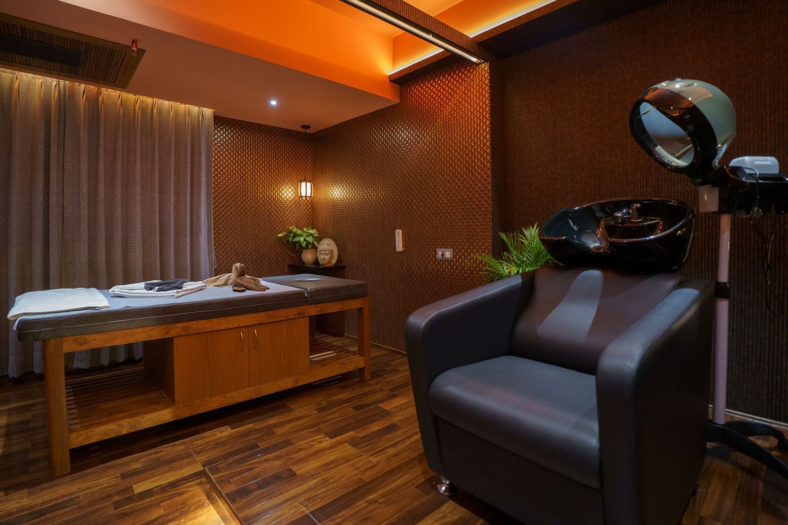 Spacious and elegant spa therapy room with modern amenities and ambient lighting - Coral Reef Hotel & Spa, Port Blair