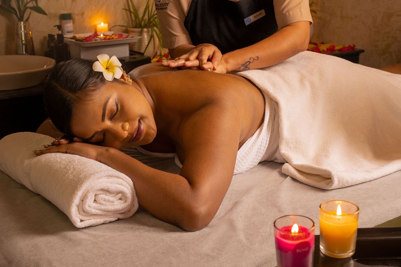 Image of a woman receiving back massages at Ayur Spa - Coral Reef Resort and Spa in Havelock