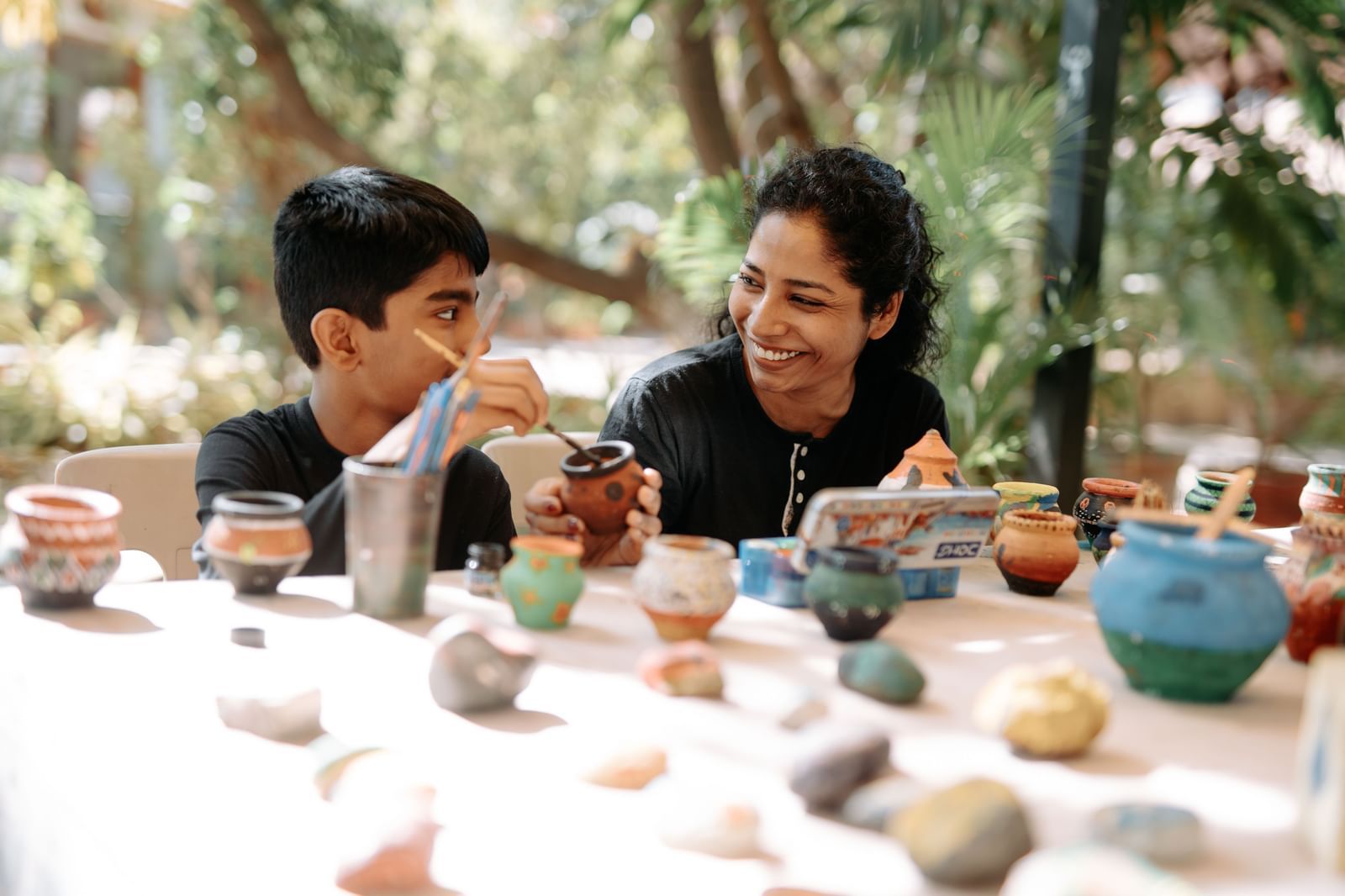 Guests enjoying a pottery-making workshop at Daksh Hotels and Resorts, highlighting cultural activities offered.