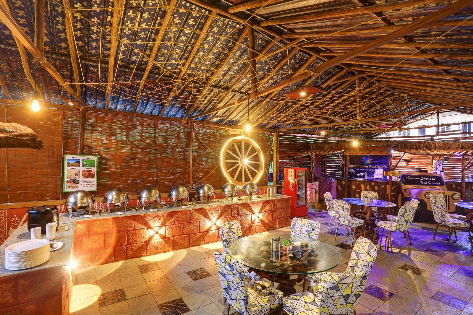 Interior of a rustic restaurant with a buffet setup and decorative bamboo roofing - Evergreen County