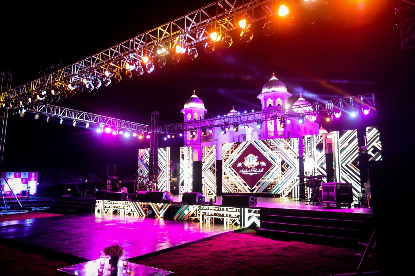 A view of the stage illuminated with neon lights featuring a digital screen - Kaldan Samudhra Palace