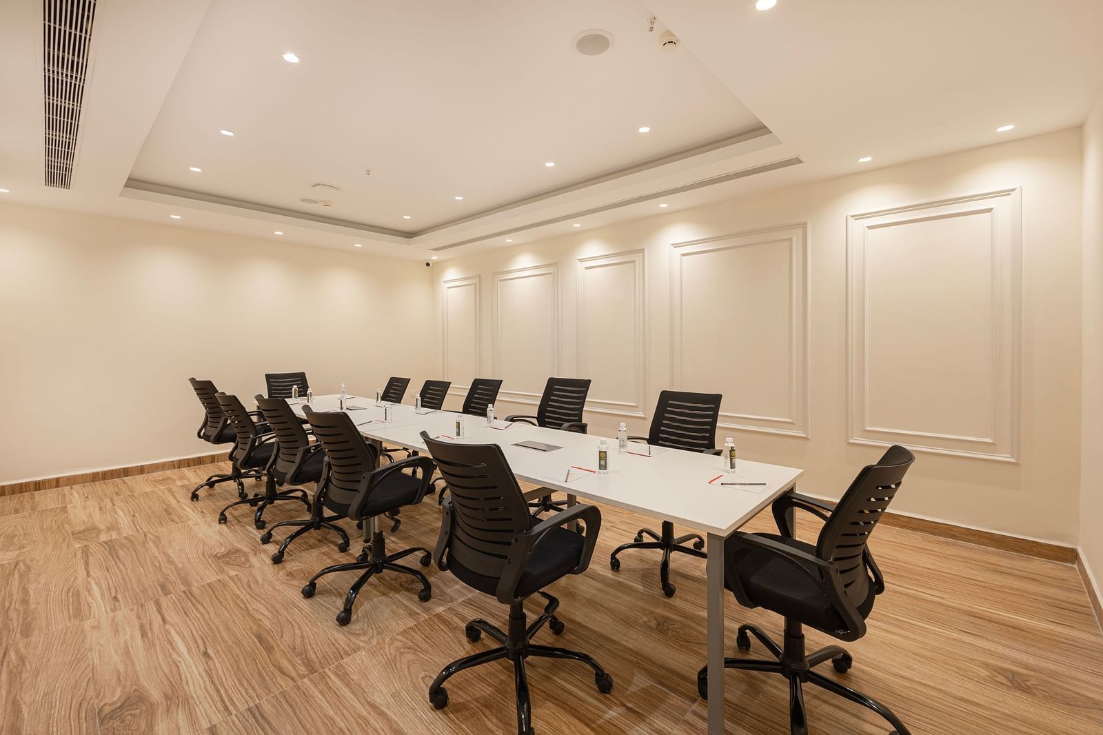 Spacious boardroom with executive chairs arranged in a U-shape at Lemonridge Hotels, IDPL Balanagar.