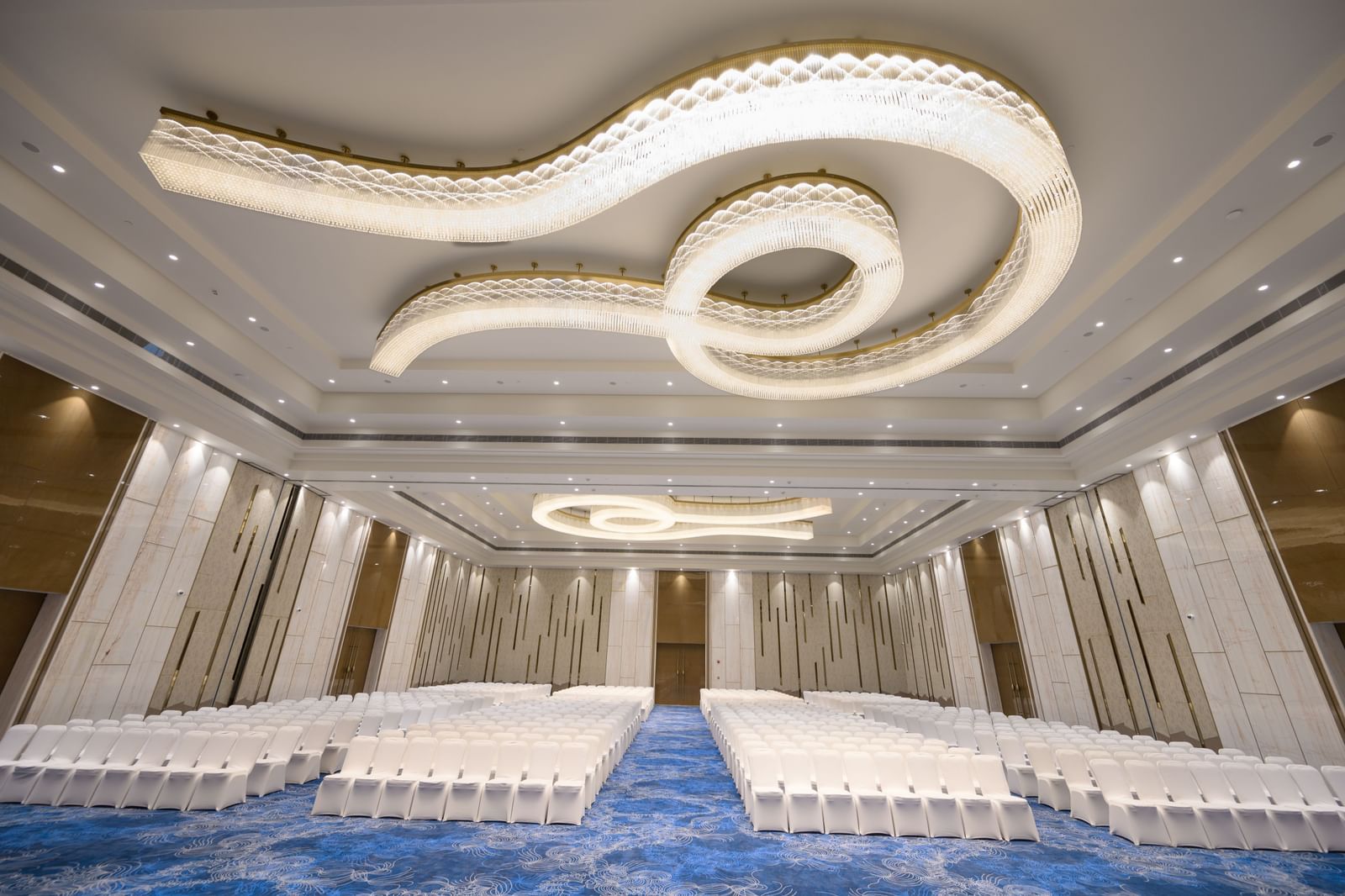 Mirai ballroom with unique ceiling lights and elegant interiors set for events at Merlis Hotel, Coimbatore