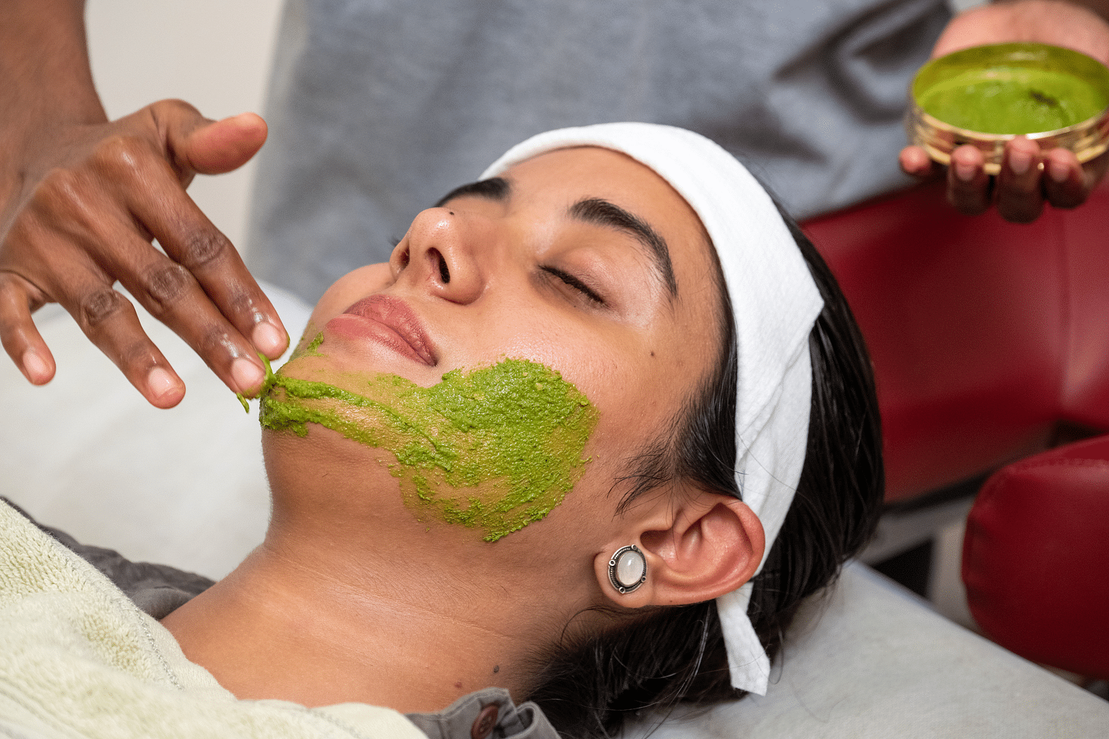 A woman receiving a treatment for her skin - Rajbagh Wellness, Udaipur