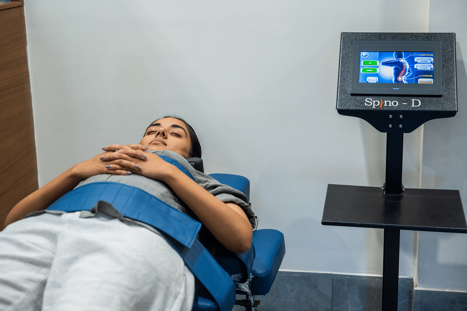 A woman taking a test for her back at our wellness centre in Udaipur - Rajbagh Wellness, Udaipur