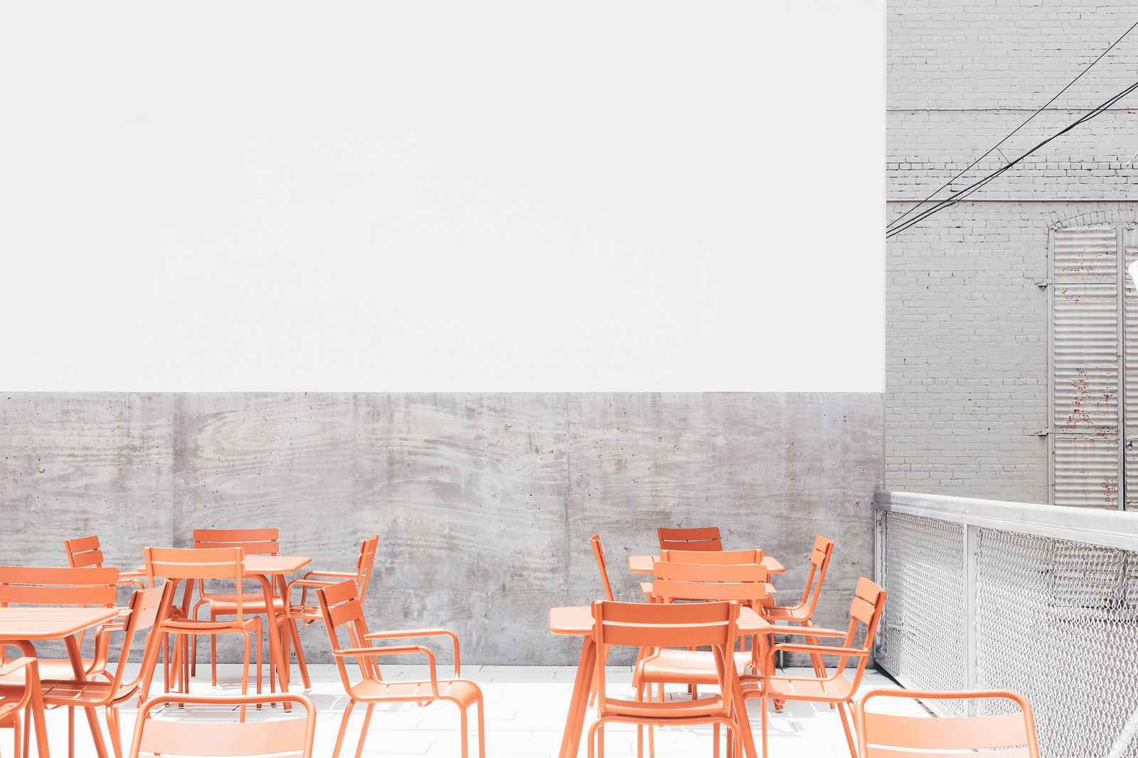 an overview of a rooftop restaurant with seating arrangements at Rhythm Gurugram
