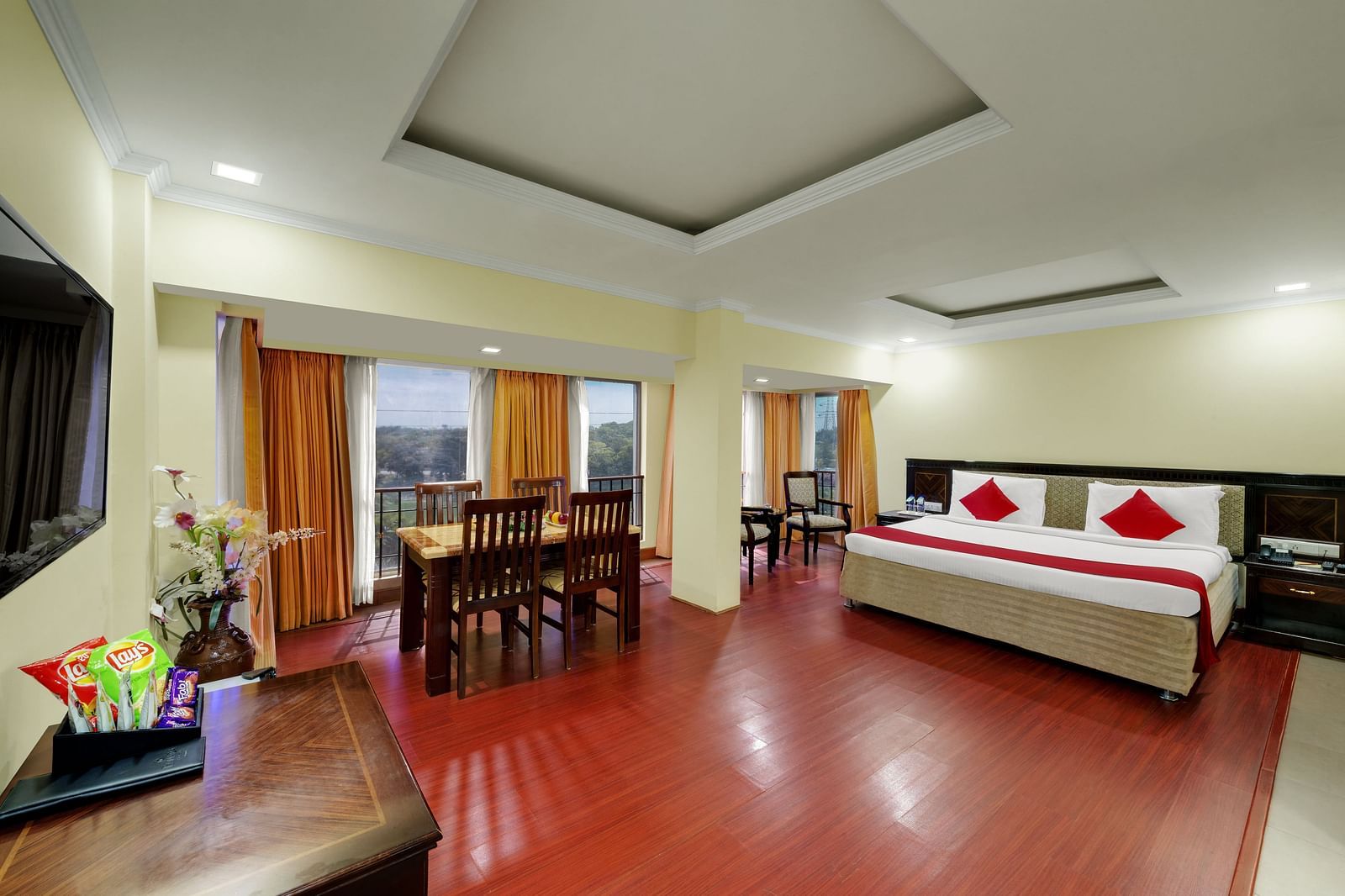 A Club Suite with comfy bed, dining table, flat screen Tv at Hotel SRM Chennai 