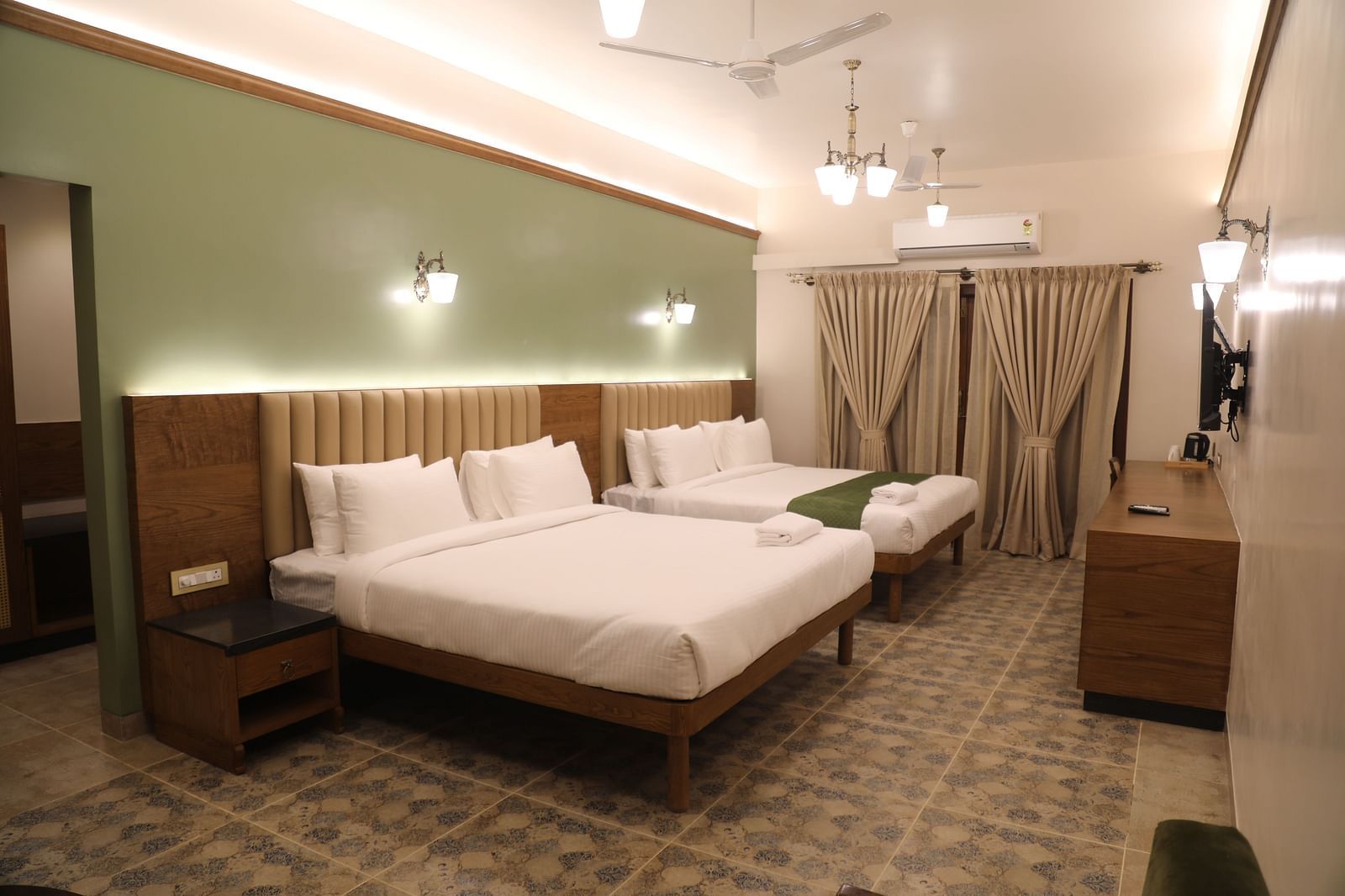 two double beds in one of the Heritage Suites at Summer House, Nandi Hills