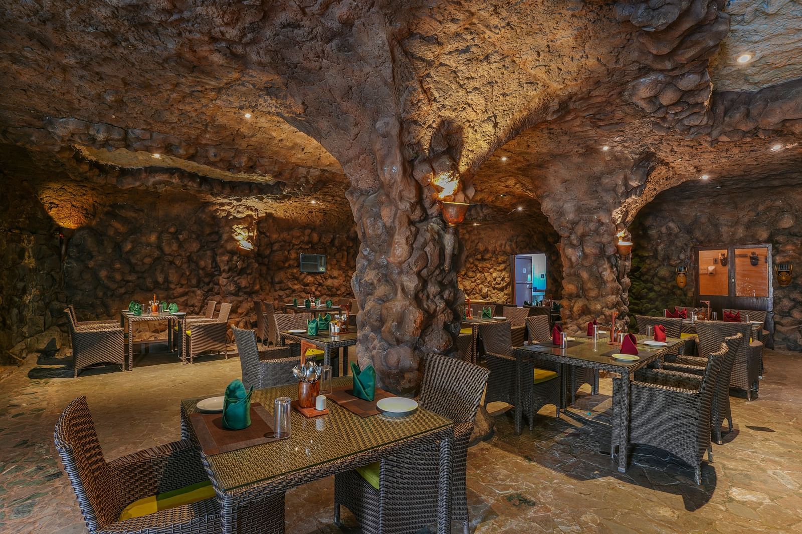 Kholong restaurant with a rock-themed décor, warm lighting, all tables, seating, and culinary arrangements arranged aesthetically2