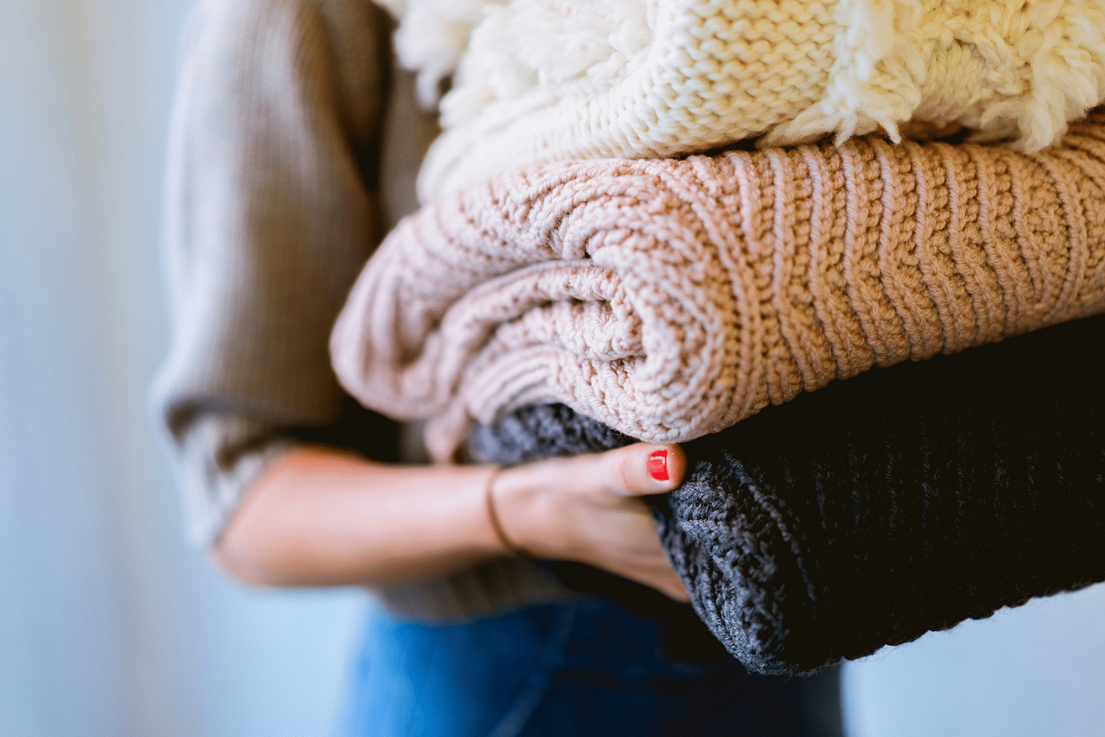 Women carry the woolen cloths after laundry.
