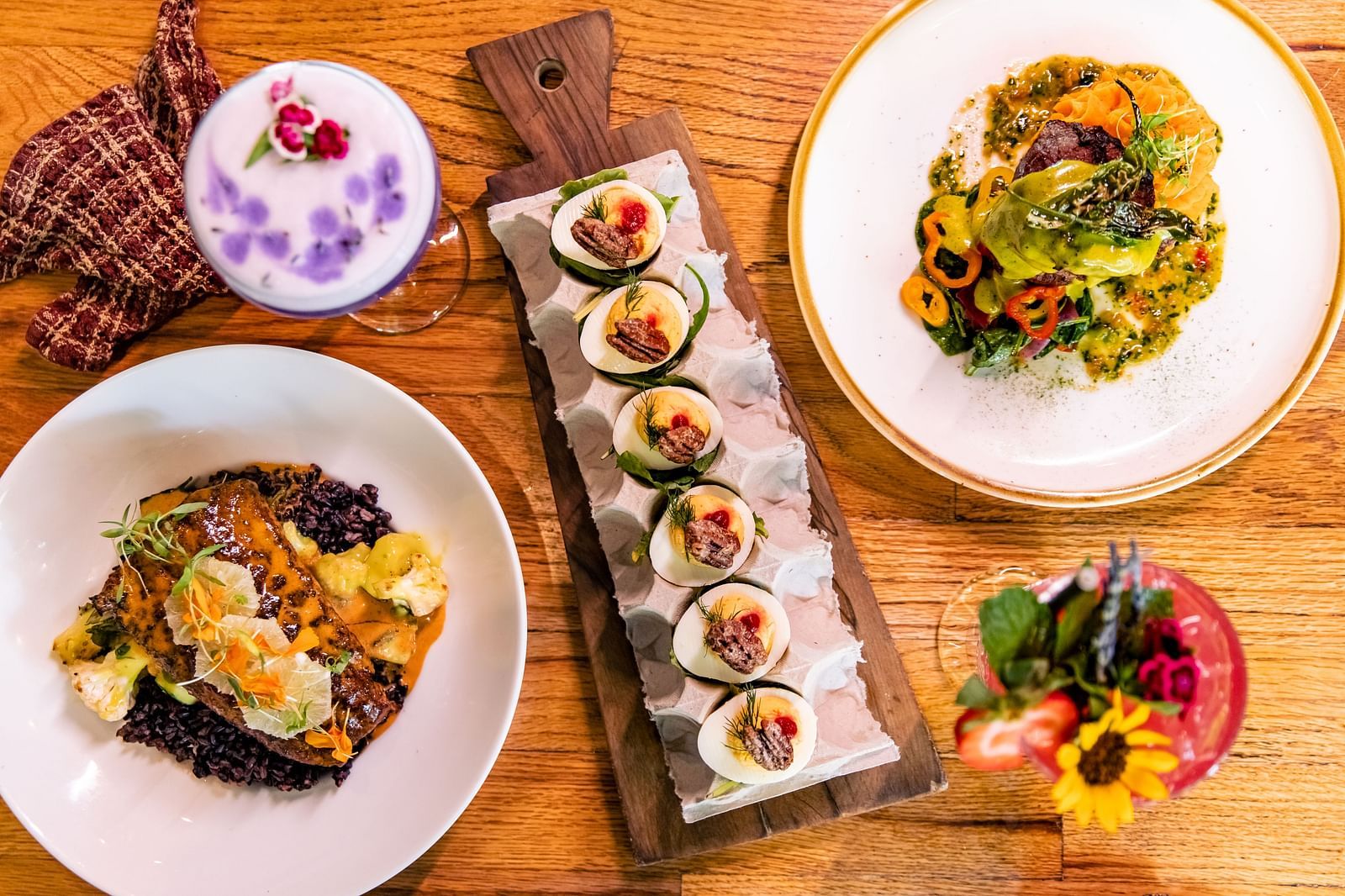 A table is neatly arranged with variety of dishes.- The Grand Hotel & Ballroom, McKinney