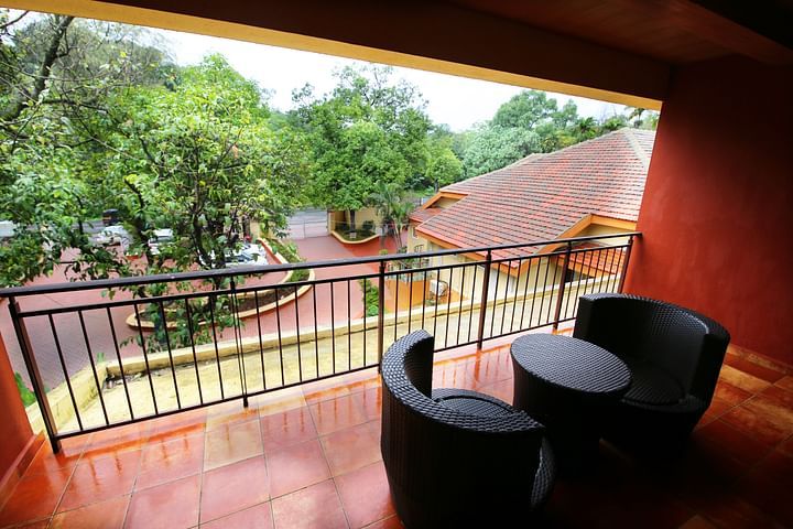 the sit out area attached to a room - Zara's Resort