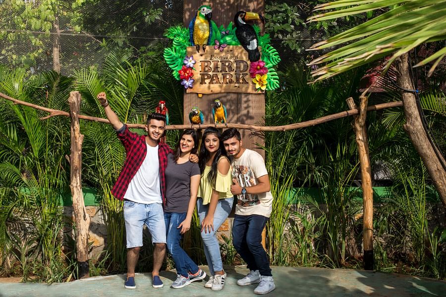 bird park esselworld,  a group taking a picture in front of the logo of bird park