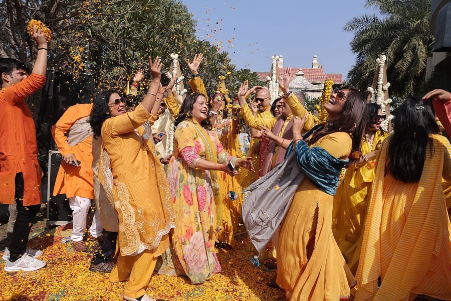 alt-text Vibrant Haldi ceremony with guests enjoying the festivities at Shri Radha Brij Vasundhara Resort & Spa.