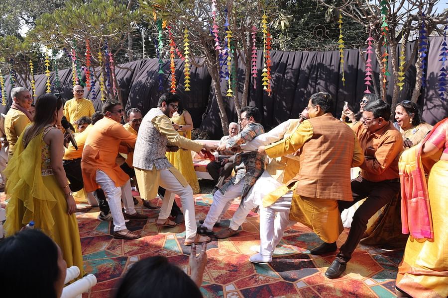 alt-text Energetic wedding celebrations with coordinated group dancing at Shri Radha Brij Vasundhara Resort & Spa.