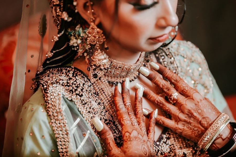 a woman in a bridal dress wearing 