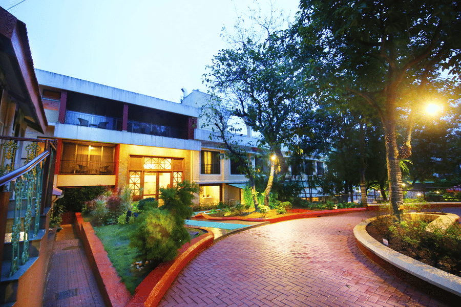 The outside lawn area of Zara's Resort during evening time