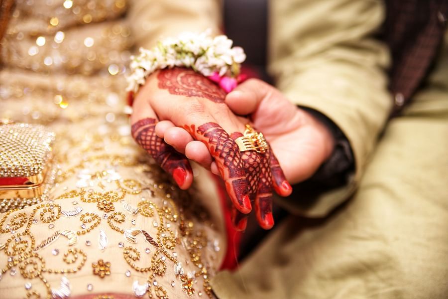 a couple holding hands during marriage