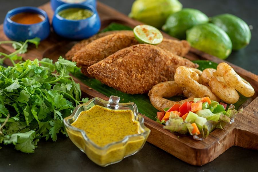 a plate of fish finger with onion rings - polo floatel kolkata