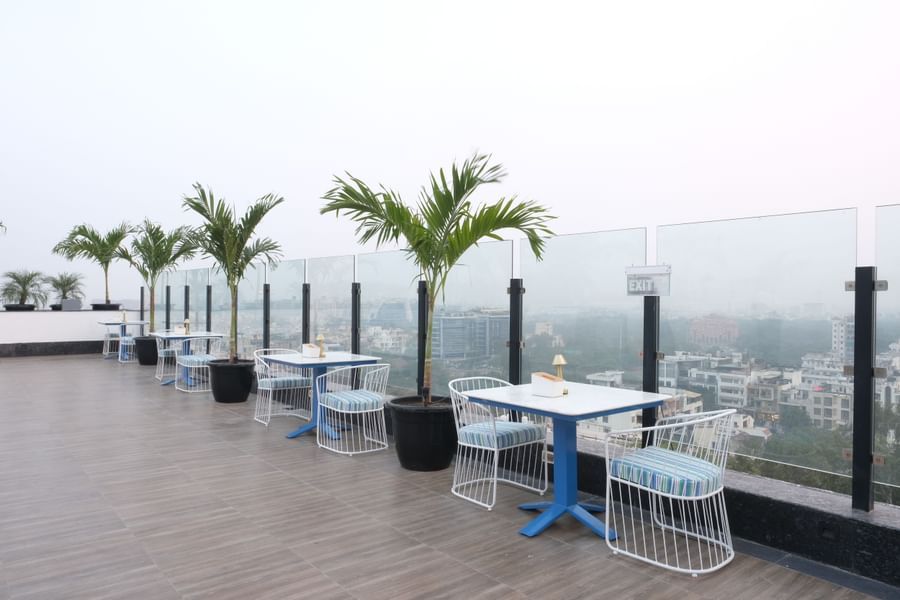 The two seater tables with balcony view at ta BLU Rooftop Bar at Clarks Amer, Jaipur