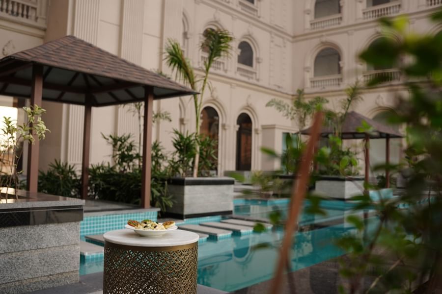 sitting area near the swimming pool at Classic Sapphire by Ananta