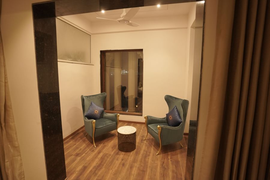 Separate sitting area in room at Classic Sapphire by Ananta
