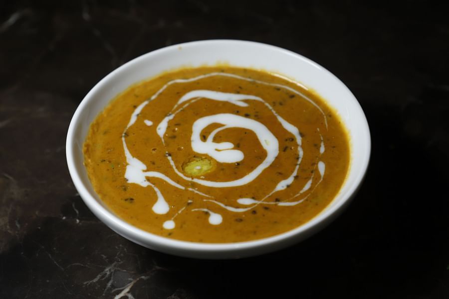 Udman By Ferns N Petals, Chattarpur - dal makhani plated on a restaurant table