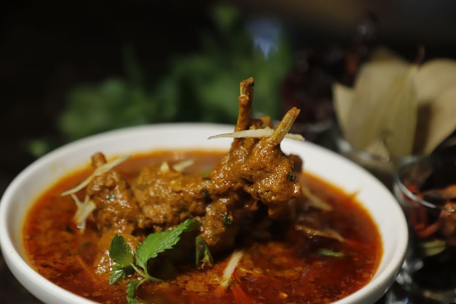 Udman By Ferns N Petals, Chattarpur - mutton rogan josh dish plated on a table